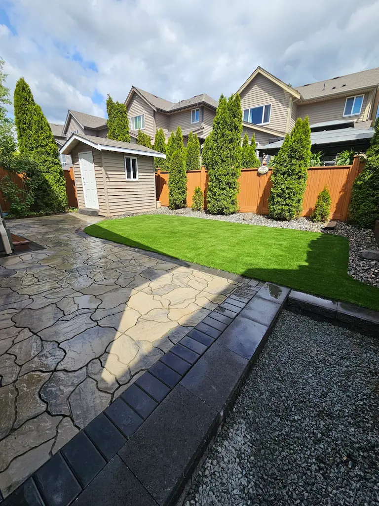 Stamped decorative concrete patio with a stone-look pattern at a Langley home