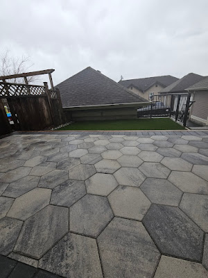 Grey hexagonal paver patio in a Langley backyard