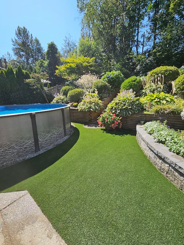 Front yard makeover in Langley with paver walkway and planting beds on a graded base